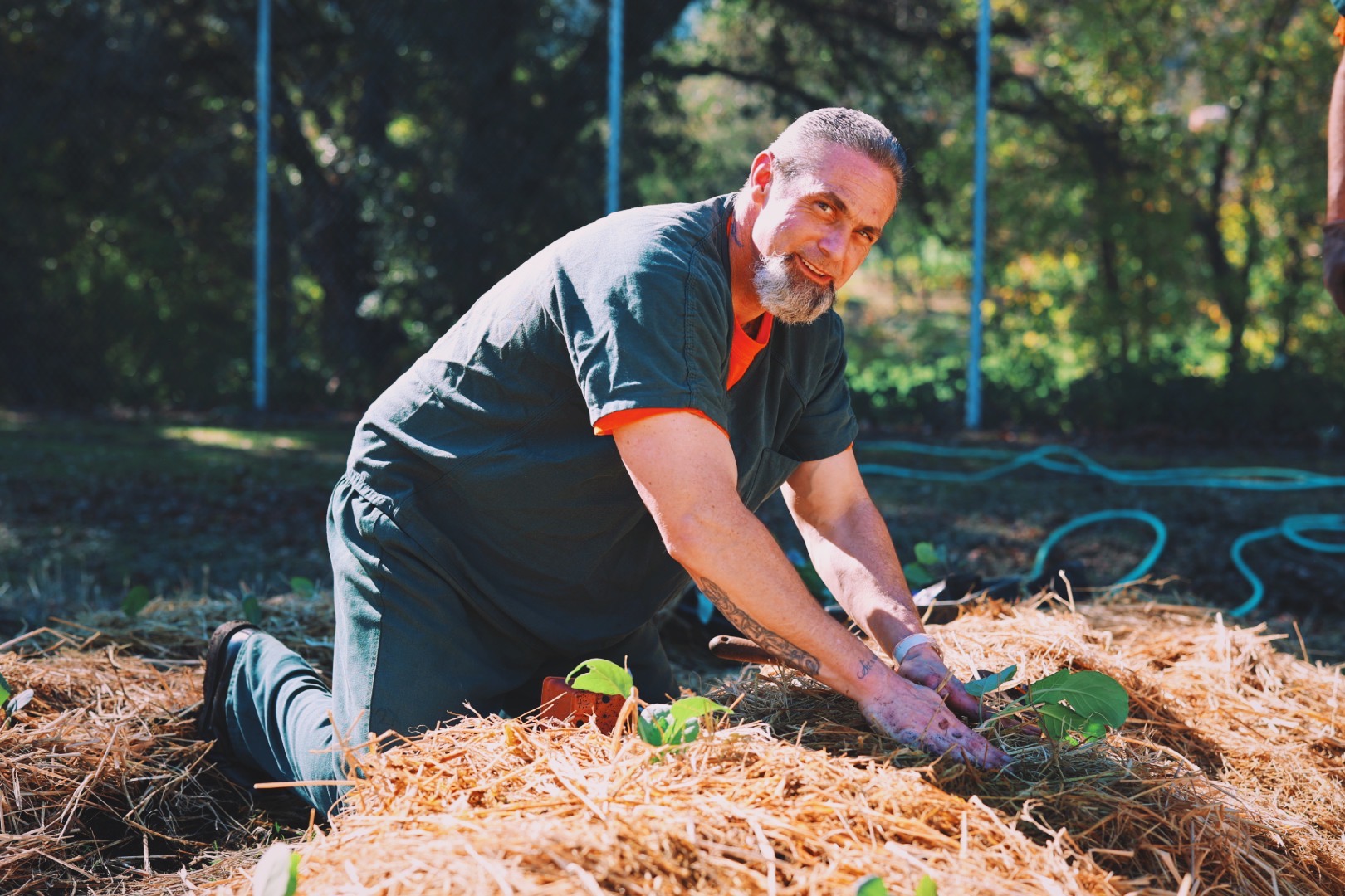 Man gardening in prison program